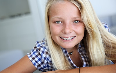 Child smiling with dental braces