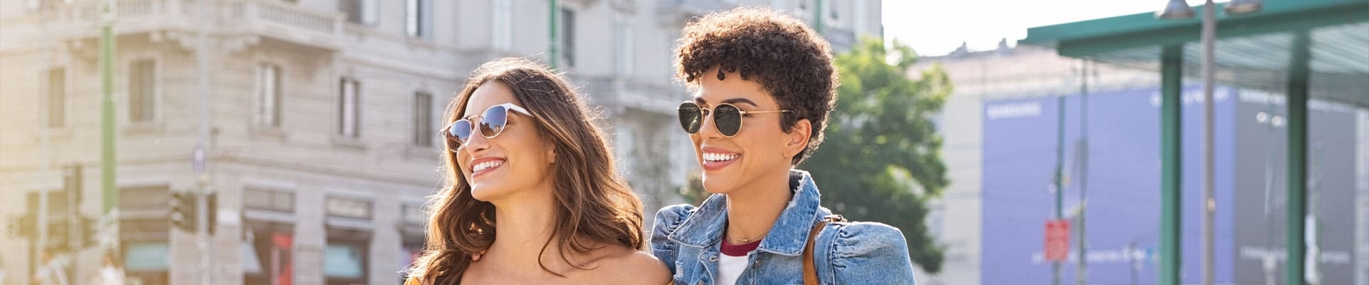 Two happy women smiling with perfect teeth