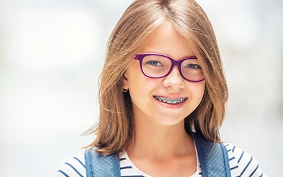 Happy child with dental braces