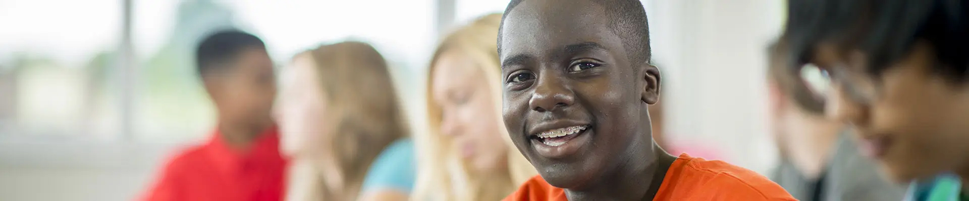 Man smiling with dental braces