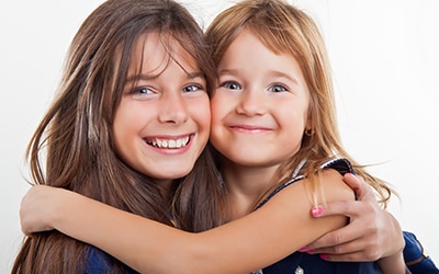 A couple of girls smiling